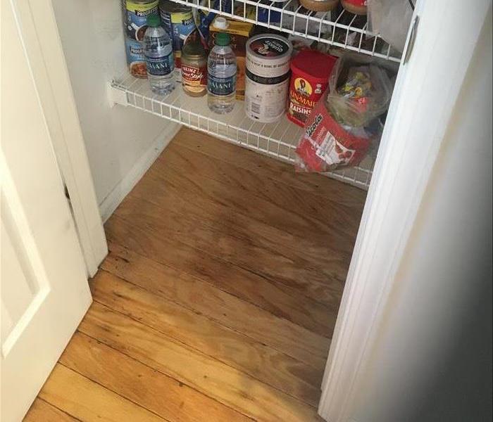 water stained hardwood boards in a pantry