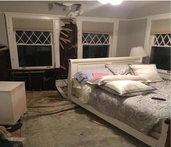 bedroom fire mess, broken wall and ceiling
