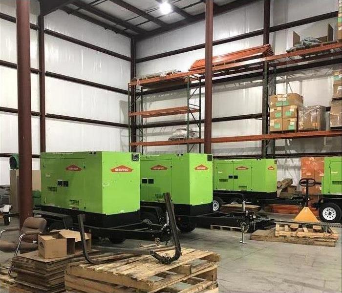 Our commercial grade backup generators in a warehouse waiting to be used
